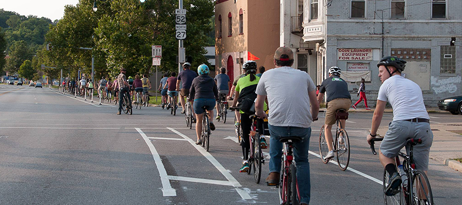 Group of cyclists using protected bike lane